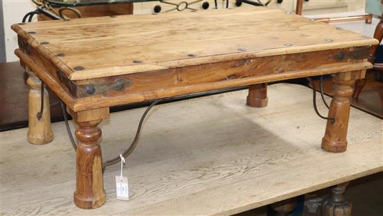 An Indonesian teak and wrought iron coffee table W.102cm
